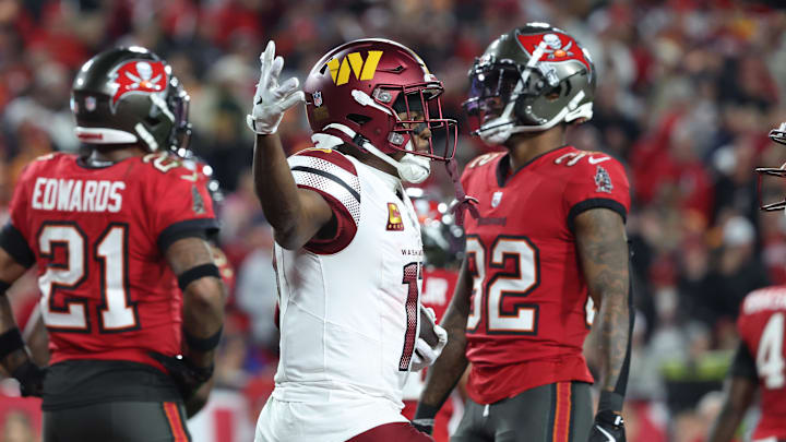 Washington Commanders wide receiver Terry McLaurin reacts after catching a touchdown.