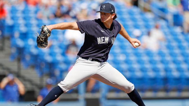 Mar 22, 2022; Dunedin, Florida, USA; New York Yankees pitcher Matt Krook (77) throws a pitch in the New York Yankees spring training game against the Toronto Blue Jays