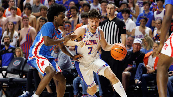 Mar 8, 2025; Gainesville, Florida, USA; Florida Gators guard Urban Klavzar (7) drives to the basket while Mississippi Rebels guard Jaylen Murray (5) defends during the second half at Exactech Arena at the Stephen C. O'Connell Center.