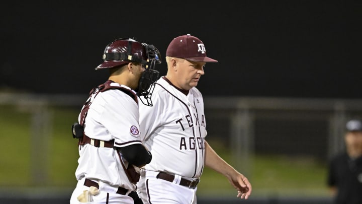 Jun 10, 2022; College Station, TX, USA; Texas A&M head coach Jim Schlossnagle walk out for a mound visit during the top of the sixth inning during the super regional game one against the Texas A&M Mandatory Credit: Maria Lysaker-USA TODAY Sports