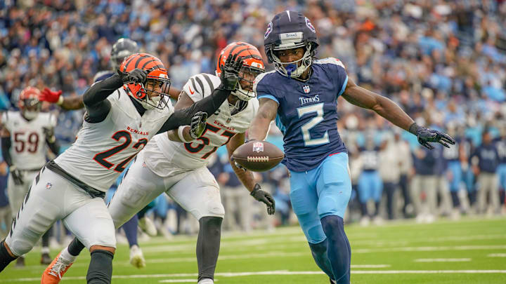 Tennessee Titans running back Tyjae Spears (2) brings in a touchdown past Cincinnati Bengals safety Geno Stone (22) and linebacker Germaine Pratt (57) during the fourth quarter at Nissan Stadium in Nashville, Tenn., Sunday, Dec. 15, 2024.
