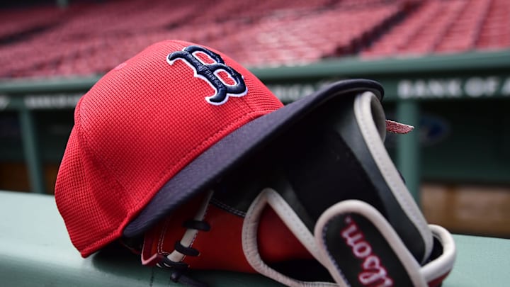 May 18, 2025; Boston, Massachusetts, USA; A Boston Red Sox hat and glove rests on the railing by the dugout prior to a game against the Atlanta Braves at Fenway Park. Mandatory Credit: Bob DeChiara-Imagn Images May 18, 2025; Boston, Massachusetts, USA; A Boston Red Sox hat and glove rests on the railing by the dugout prior to a game against the Atlanta Braves at Fenway Park. Mandatory Credit: Bob DeChiara-Imagn Images