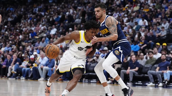Mar 28, 2025; Denver, Colorado, USA; Denver Nuggets forward Michael Porter Jr. (1) defends on Utah Jazz guard Collin Sexton (2) in the second quarter at Ball Arena. Mandatory Credit: Ron Chenoy-Imagn Images