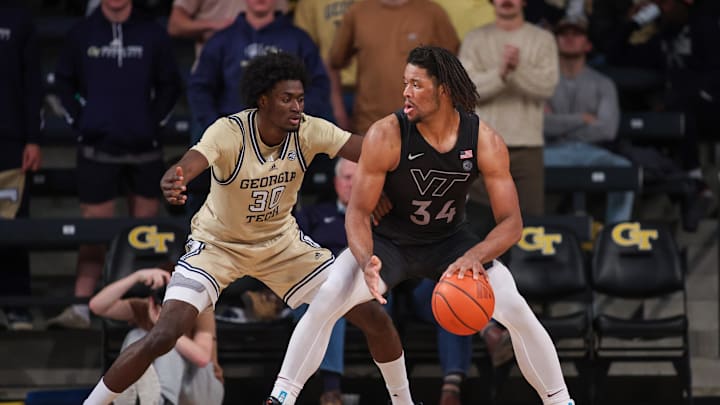 Jan 22, 2025; Atlanta, Georgia, USA; Georgia Tech Yellow Jackets forward Ibrahim Souare (30) defends Virginia Tech Hokies forward Mylyjael Poteat (34) in the second half at McCamish Pavilion. Mandatory Credit: Brett Davis-Imagn Images