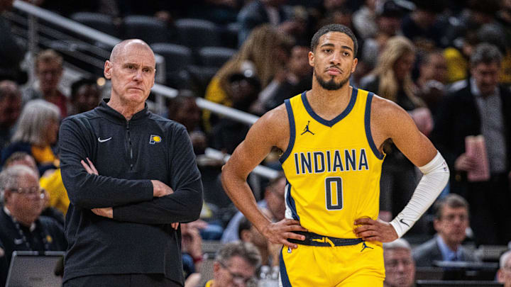 Oct 30, 2023; Indianapolis, Indiana, USA; Indiana Pacers head coach Rick Carlisle and guard Tyrese Haliburton (0) look on in the second half against the Chicago Bulls at Gainbridge Fieldhouse. Mandatory Credit: Trevor Ruszkowski-Imagn Images