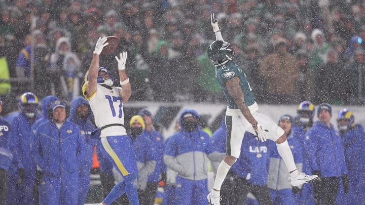 Jan 19, 2025; Philadelphia, Pennsylvania, USA; Los Angeles Rams wide receiver Puka Nacua (17) catches a pass as Philadelphia Eagles cornerback Darius Slay Jr. (2) defends in the second half in a 2025 NFC divisional round game at Lincoln Financial Field.  