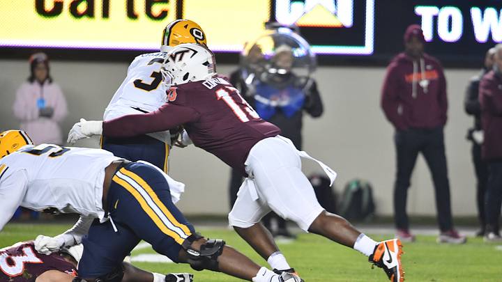 Oct 24, 2025; Blacksburg, Virginia, USA; Virginia Tech Hokies defensive lineman Kemari Copeland (13) sacks California Golden Bears quarterback Jaron-Keawe Sagapolutele (3) during the first quarter at Lane Stadium. Mandatory Credit: Brian Bishop-Imagn Images Oct 24, 2025; Blacksburg, Virginia, USA; Virginia Tech Hokies defensive lineman Kemari Copeland (13) sacks California Golden Bears quarterback Jaron-Keawe Sagapolutele (3) during the first quarter at Lane Stadium. Mandatory Credit: Brian Bishop-Imagn Images