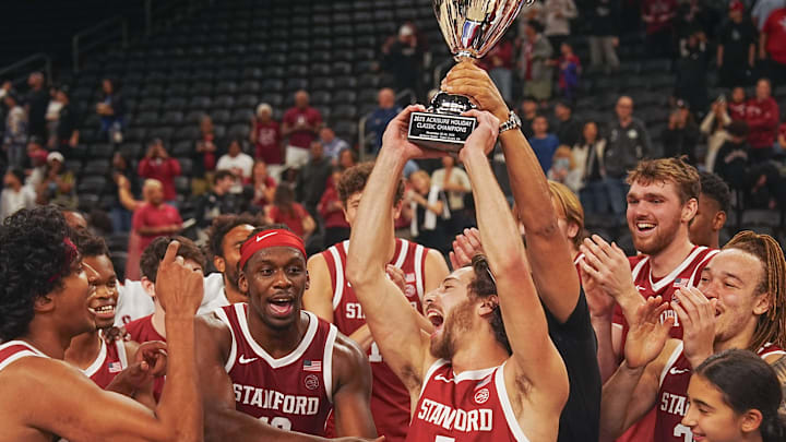 Benny Gealer raises the trophy after making a three-pointer with .08 seconds left to give Stanford the win over St. Louis University in the Acrisure Invitational Champioship game at Acrisure Arena in Palm Desert, Calif., Nov. 28, 2025.