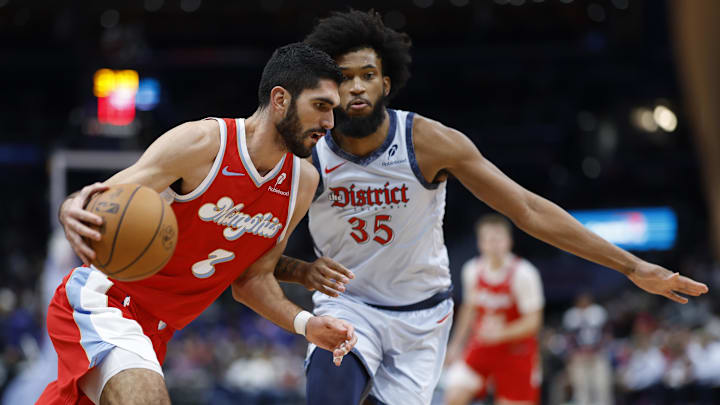 Dec 8, 2024; Washington, District of Columbia, USA; Memphis Grizzlies forward Santi Aldama (7) drives to the basket as Washington Wizards forward Marvin Bagley III (35) defends in the fourth quarter at Capital One Arena. Mandatory Credit: Geoff Burke-Imagn Images