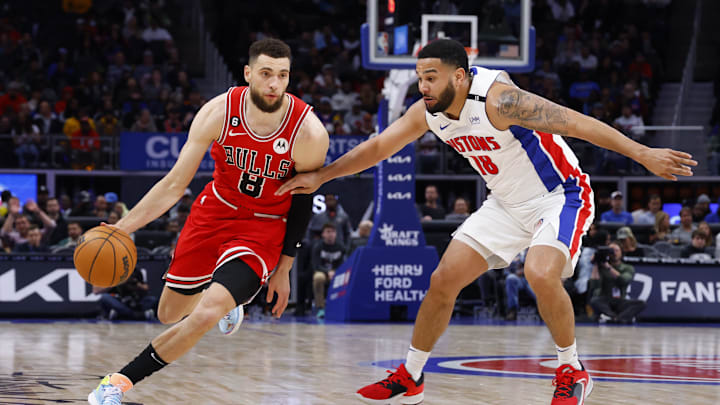 Mar 1, 2023; Detroit, Michigan, USA;  Chicago Bulls guard Zach LaVine (8) dribbles on Detroit Pistons guard Cory Joseph (18) in the second half at Little Caesars Arena. Mandatory Credit: Rick Osentoski-Imagn Images