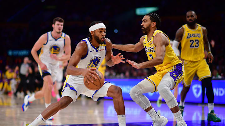 Apr 3, 2025; Los Angeles, California, USA; Golden State Warriors guard Moses Moody (4) moves to the basket against Los Angeles Lakers guard Gabe Vincent (7) during the second half at Crypto.com Arena. Mandatory Credit: Gary A. Vasquez-Imagn Images