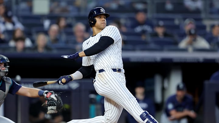 May 20, 2024; Bronx, New York, USA; New York Yankees right fielder Juan Soto (22) follows through on a single against the Seattle Mariners during the fifth inning at Yankee Stadium. Mandatory Credit: Brad Penner-USA TODAY Sports