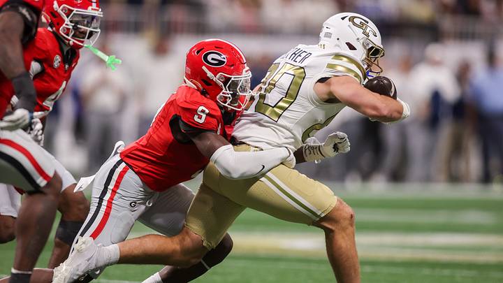 Nov 28, 2025; Atlanta, Georgia, USA; Georgia Bulldogs linebacker Chris Cole (9) tackles Georgia Tech Yellow Jackets tight end Brett Seither (80) in the fourth quarter at Mercedes-Benz Stadium. Mandatory Credit: Brett Davis-Imagn Images Nov 28, 2025; Atlanta, Georgia, USA; Georgia Bulldogs linebacker Chris Cole (9) tackles Georgia Tech Yellow Jackets tight end Brett Seither (80) in the fourth quarter at Mercedes-Benz Stadium. Mandatory Credit: Brett Davis-Imagn Images