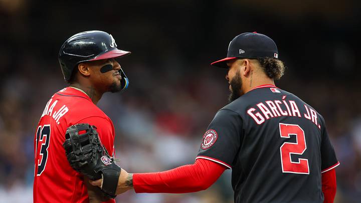 May 22, 2026; Atlanta, Georgia, USA; Atlanta Braves right fielder Ronald Acuna Jr. (13) is tagged out by Washington Nationals first baseman Luis Garcia Jr. (2) in the third inning at Truist Park. Mandatory Credit: Brett Davis-Imagn Images
