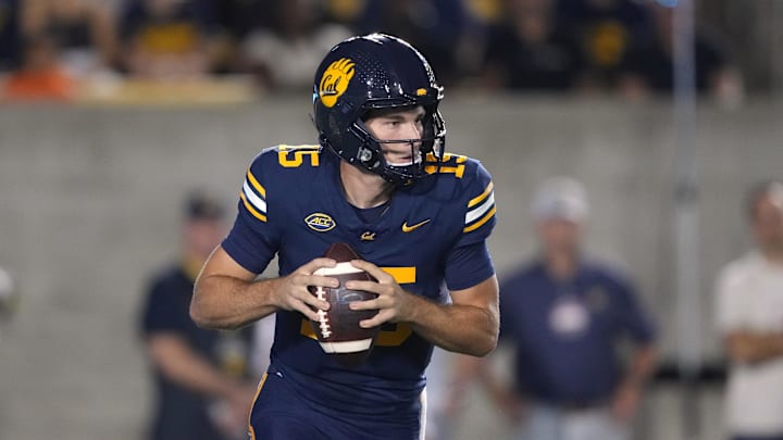 Oct 5, 2024; Berkeley, California, USA; California Golden Bears quarterback Fernando Mendoza (15) drops back to pass against the Miami Hurricanes during the first quarter at California Memorial Stadium. Mandatory Credit: Darren Yamashita-Imagn Images