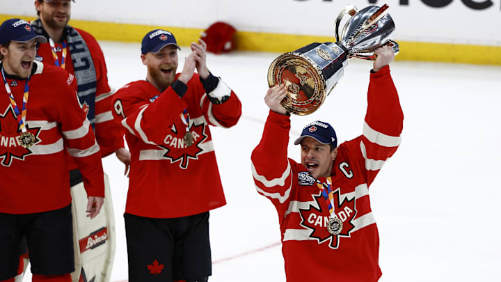 Feb 20, 2025; Boston, MA, USA; [Imagn Images direct customers only] Team Canada forward Sydney Crosby (87) lifts the trophy after defeating the United States during the 4 Nations Face-Off ice hockey championship game at TD Garden. Mandatory Credit: Winslow Townson-Imagn Images