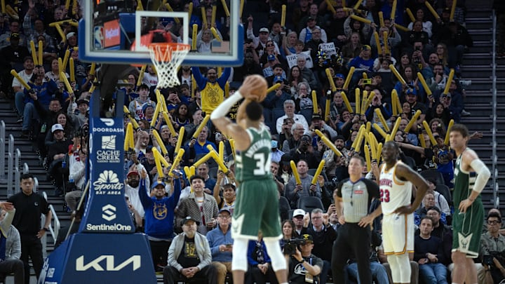 Mar 18, 2025; San Francisco, California, USA; Golden State Warriors fans attempt to distract Milwaukee Bucks forward Giannis Antetokounmpo (34) as he shoots a free throw during the fourth quarter at Chase Center. Mandatory Credit: D. Ross Cameron-Imagn Images