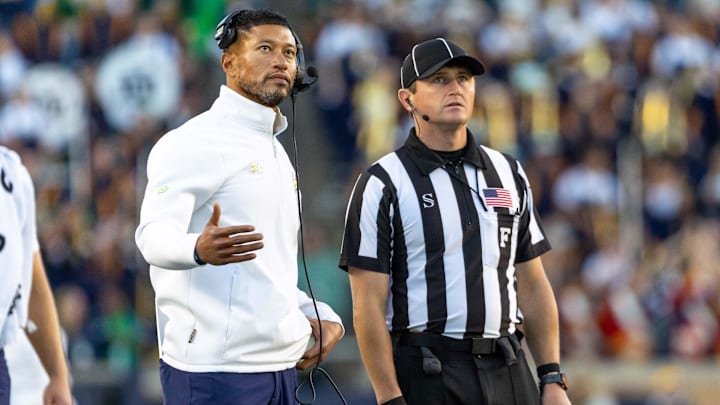Notre Dame Fighting Irish head coach Marcus Freeman talks with an official against the NC State Wolfpack