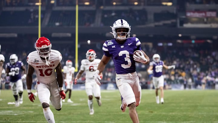 Dec 26, 2024; Phoenix, AZ, USA; Kansas State Wildcats running back Dylan Edwards (3) runs for a touchdown against the Rutgers Scarlet Knights during the second half of the Rate Bowl at Chase Field. Mandatory Credit: Mark J. Rebilas-Imagn Images