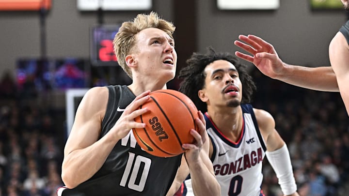 Jan 11, 2025; Spokane, Washington, USA; Washington State Cougars guard Parker Gerrits (10) goes up for a shot against Gonzaga Bulldogs guard Ryan Nembhard (0) in the second half at McCarthey Athletic Center. Mandatory Credit: James Snook-Imagn Images