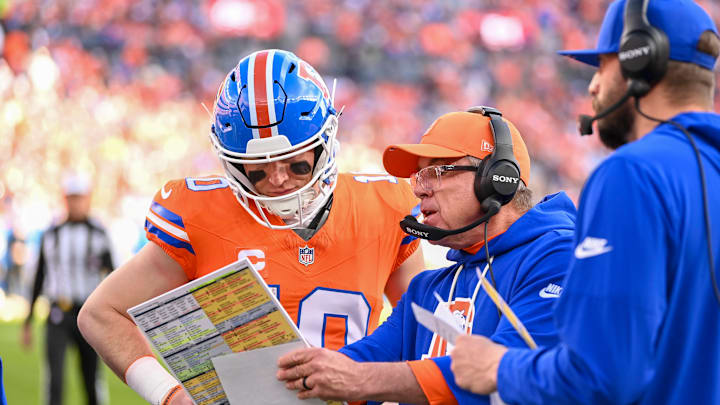 DENVER, CO - JANUARY 04: Denver Head Coach, Sean Payton and Bo Nix 10 of the Denver Broncos, discuss a play during a game between the Los Angeles Chargers and the Denver Broncos at Empower Field at Mile High in Denver, CO on January 04, 2026. 
