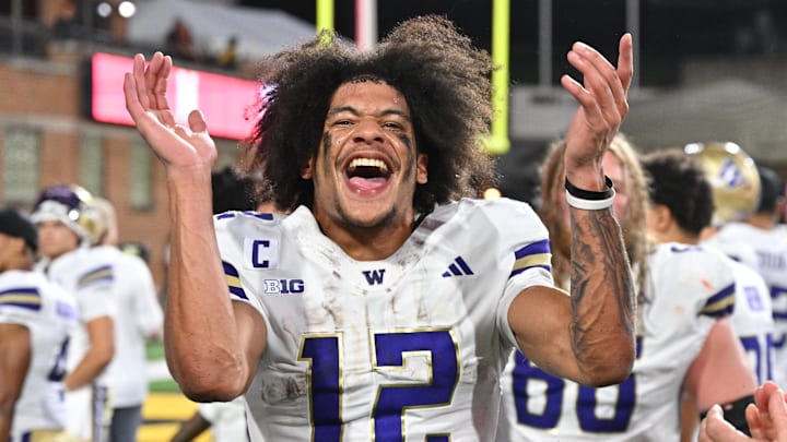 Oct 4, 2025; College Park, Maryland, USA;  Washington Huskies wide receiver Denzel Boston (12) celebrates after the Huskies comeback victory over the Maryland Terrapins at SECU Stadium. Mandatory Credit: Jamie Sabau-Imagn Images