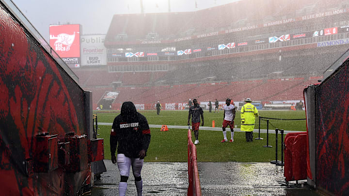 Aug 16, 2019; Tampa, FL, USA; Members of the  Tampa Bay Buccaneers walk off the field as a heavy