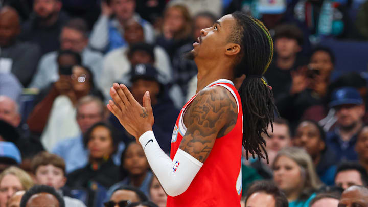 Jan 20, 2025; Memphis, Tennessee, USA; Memphis Grizzlies guard Ja Morant (12) reacts during the second quarter against the Minnesota Timberwolves at FedExForum. Mandatory Credit: Petre Thomas-Imagn Images