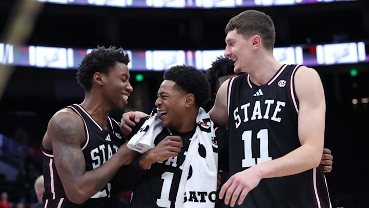 Mississippi State Bulldogs guard King Grace (23) along with guard Dellquan Warren (1) and forward Sergej MacUra (11) celebrate a win over the Utah Utes after the game at Delta Center. Mississippi State Bulldogs guard King Grace (23) along with guard Dellquan Warren (1) and forward Sergej MacUra (11) celebrate a win over the Utah Utes after the game at Delta Center.