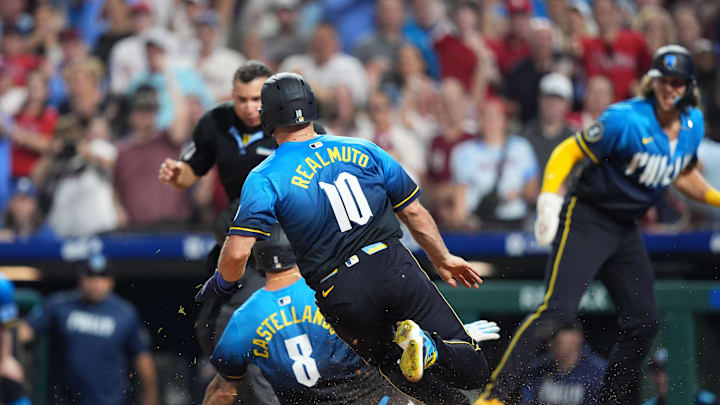 Jun 20, 2025; Philadelphia, Pennsylvania, USA; Philadelphia Phillies catcher J.T. Realmuto (10) and outfielder Nick Castellanos (8) advance home to score against the New York Mets in the seventh inning at Citizens Bank Park. Mandatory Credit: Kyle Ross-Imagn Images