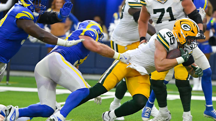 Oct 6, 2024; Inglewood, California, USA; Green Bay Packers tight end Tucker Kraft (85) breaks a tackle by Los Angeles Rams linebacker Troy Reeder (51) and scores a touchdown in the third quarter at SoFi Stadium. Mandatory Credit: Robert Hanashiro-Imagn Images Oct 6, 2024; Inglewood, California, USA; Green Bay Packers tight end Tucker Kraft (85) breaks a tackle by Los Angeles Rams linebacker Troy Reeder (51) and scores a touchdown in the third quarter at SoFi Stadium. Mandatory Credit: Robert Hanashiro-Imagn Images