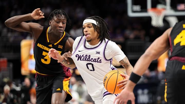 Mar 11, 2025; Kansas City, MO, USA; Kansas State Wildcats guard Dug McDaniel (0) drives to the basket around Arizona State Sun Devils guard Joson Sanon (3) during the first half at T-Mobile Center. Mandatory Credit: William Purnell-Imagn Images