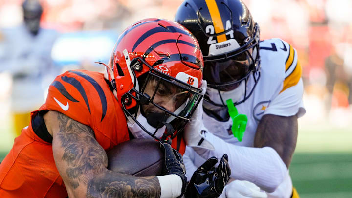 Cincinnati Bengals running back Chase Brown (30) is knocked out of bounds short of the goal line by Pittsburgh Steelers cornerback Joey Porter Jr. (24) in the first quarter of the NFL Week 13 game between the Cincinnati Bengals and the Pittsburgh Steelers at Paycor Stadium in downtown Cincinnati on Sunday, Dec. 1, 2024.