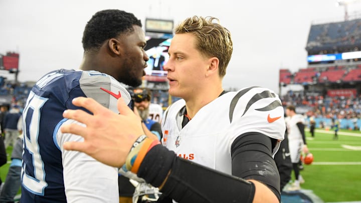 Dec 15, 2024; Nashville, Tennessee, USA;  Cincinnati Bengals quarterback Joe Burrow (9) shakes heads with Tennessee Titans defensive tackle Jeffery Simmons (98) during the second half at Nissan Stadium. Mandatory Credit: Steve Roberts-Imagn Images