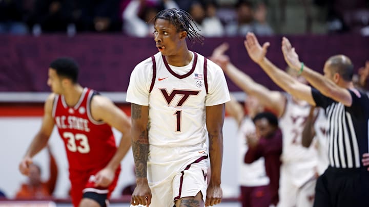 Jan 15, 2025; Blacksburg, Virginia, USA; Virginia Tech Hokies forward Tobi Lawal (1) celebrate after making a three pointer during the second half against the North Carolina State Wolfpack at Cassell Coliseum. Mandatory Credit: Peter Casey-Imagn Images