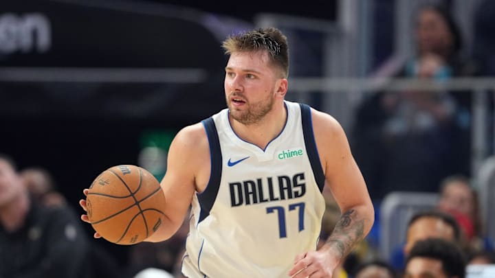 Dec 15, 2024; San Francisco, California, USA; Dallas Mavericks guard Luka Doncic (77) dribbles against the Golden State Warriors during the second quarter at Chase Center. Mandatory Credit: Darren Yamashita-Imagn Images Dec 15, 2024; San Francisco, California, USA; Dallas Mavericks guard Luka Doncic (77) dribbles against the Golden State Warriors during the second quarter at Chase Center. Mandatory Credit: Darren Yamashita-Imagn Images