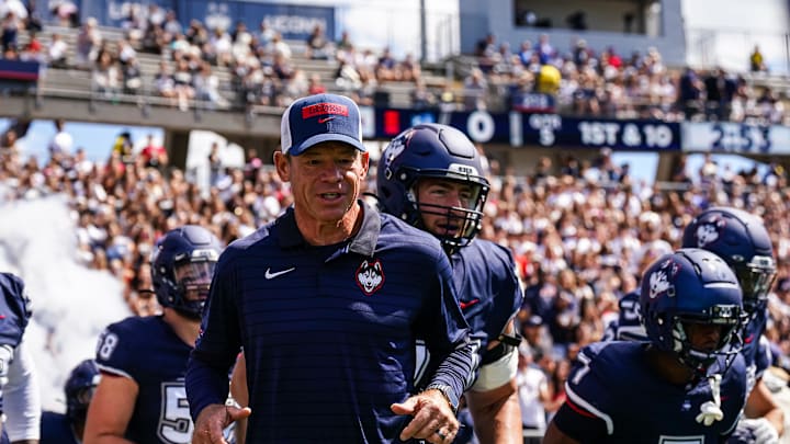 Aug 30, 2025; East Hartford, Connecticut, USA; Connecticut Huskies head coach Jim Mora runs onto the field before the start of the game against the Central Connecticut State Blue Devils at Pratt & Whitney Stadium at Rentschler Field. Mandatory Credit: David Butler II-Imagn Images Aug 30, 2025; East Hartford, Connecticut, USA; Connecticut Huskies head coach Jim Mora runs onto the field before the start of the game against the Central Connecticut State Blue Devils at Pratt & Whitney Stadium at Rentschler Field. Mandatory Credit: David Butler II-Imagn Images