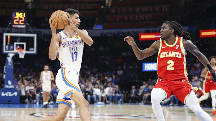 Oct 17, 2024; Oklahoma City, Oklahoma, USA; Oklahoma City Thunder forward Malevy Leons (17) drives to the basket against Atlanta Hawks guard Keaton Wallace (2) during the second half at Paycom Center. Oct 17, 2024; Oklahoma City, Oklahoma, USA; Oklahoma City Thunder forward Malevy Leons (17) drives to the basket against Atlanta Hawks guard Keaton Wallace (2) during the second half at Paycom Center.