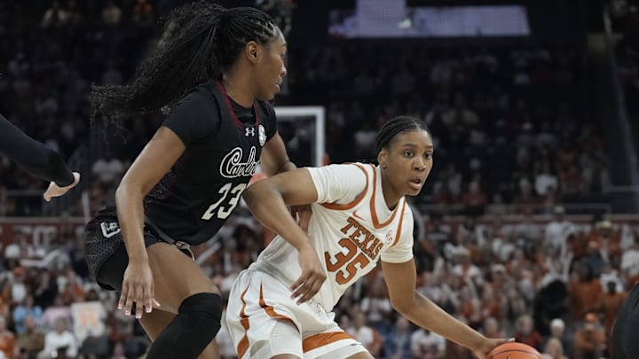 Feb 9, 2025; Austin, Texas, USA; Texas Longhorns forward Madison Booker (35) drives to the basket while defended by South Carolina Gamecocks guard Bree Hall (23) during the first half at Moody Center. Mandatory Credit: Scott Wachter-Imagn Images
