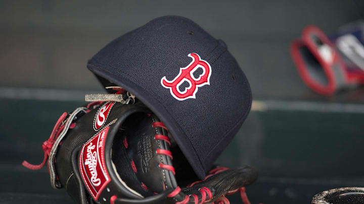 May 14, 2014; Minneapolis, MN, USA; A general view of a glove and Boston Red Sox hat in the dugout prior to a game between the Boston Red Sox and Minnesota Twins at Target Field. Mandatory Credit: Jesse Johnson-Imagn Images