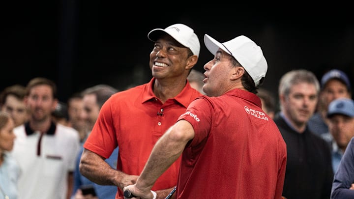 Golfers Tiger Woods and Kevin Kisner warm up at SoFi Center before the TGL match between Jupiter Links and Los Angeles Golf Club.