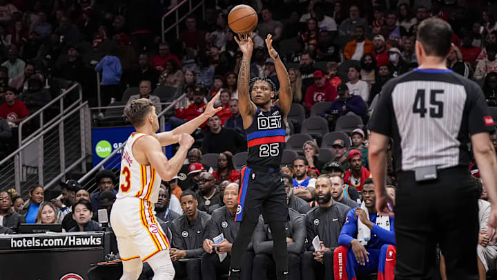 Apr 3, 2024; Atlanta, Georgia, USA; Detroit Pistons guard Marcus Sasser (25) shoots over Atlanta Hawks guard Bogdan Bogdanovic (13) during the second half at State Farm Arena. Mandatory Credit: Dale Zanine-Imagn Images