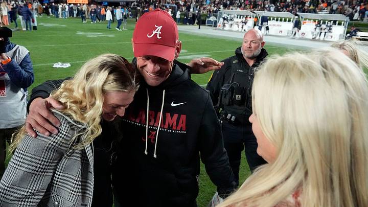 Nov 29, 2025; Auburn, Alabama, USA; Alabama head coach Kalen DeBoer celebrates with his wife and daughters after Alabama defeated Auburn at Jordan-Hare Stadium. Mandatory Credit: Gary Cosby Jr.-Tuscaloosa News
