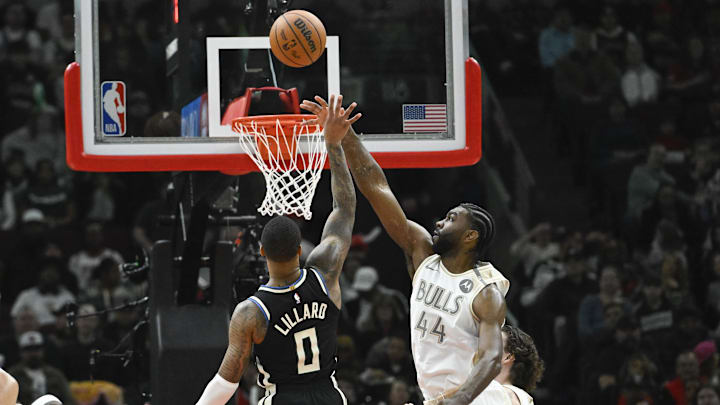 Dec 28, 2024; Chicago, Illinois, USA;  Milwaukee Bucks guard Damian Lillard (0) shoots against Chicago Bulls forward Patrick Williams (44) during the first half at the United Center. Mandatory Credit: Matt Marton-Imagn Images