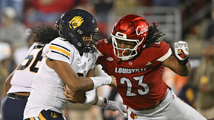 Cal quarterback Jaron-Keawe Sagapolutele is sacked by Louisville's Wesley Bailey