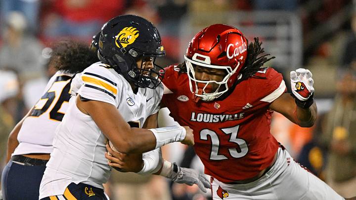 Nov 8, 2025; Louisville, Kentucky, USA; Louisville Cardinals defensive lineman Wesley Bailey (23) sacks California Golden Bears quarterback Jaron-Keawe Sagapolutele (3) during the second half at L&N Federal Credit Union Stadium. California defeated Louisville 29-26. Mandatory Credit: Jamie Rhodes-Imagn Images Nov 8, 2025; Louisville, Kentucky, USA; Louisville Cardinals defensive lineman Wesley Bailey (23) sacks California Golden Bears quarterback Jaron-Keawe Sagapolutele (3) during the second half at L&N Federal Credit Union Stadium. California defeated Louisville 29-26. Mandatory Credit: Jamie Rhodes-Imagn Images