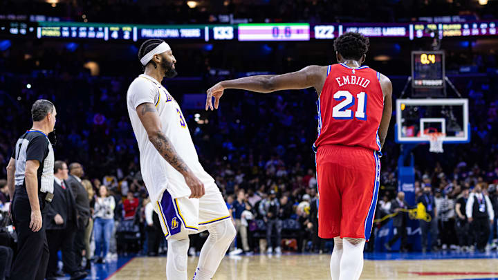 Dec 9, 2022; Philadelphia, Pennsylvania, USA; Philadelphia 76ers center Joel Embiid (21) jokingly pushes Los Angeles Lakers forward Anthony Davis (3) as time winds down on an overtime 76ers victory at Wells Fargo Center. Mandatory Credit: Bill Streicher-USA TODAY Sports