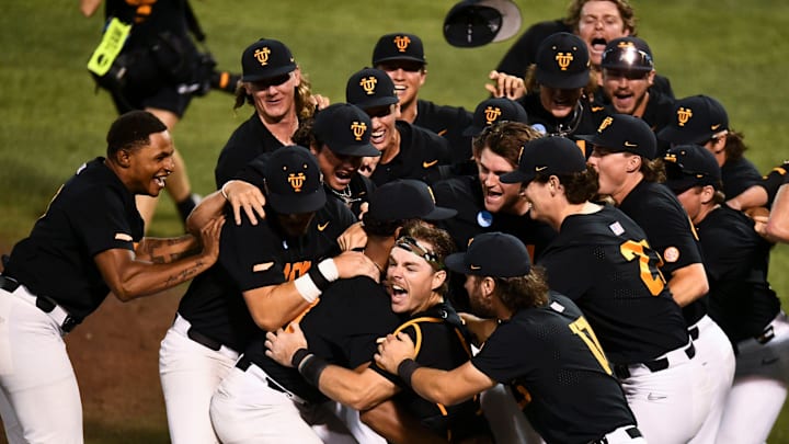 Tennessee's Cal Stark (10) and Tennessee's Marcus Phillips (44) and the center of the dogpile as the teams celebrates their win over Evansville in the Knoxville Super Regional of the NCAA baseball tournament on Sunday, June 9, 2024 in Knoxville, Tenn.