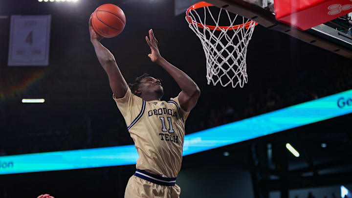 Mar 1, 2025; Atlanta, Georgia, USA; Georgia Tech Yellow Jackets forward Baye Ndongo (11) dunks against the North Carolina State Wolfpack in the second half at McCamish Pavilion. Mandatory Credit: Brett Davis-Imagn Images