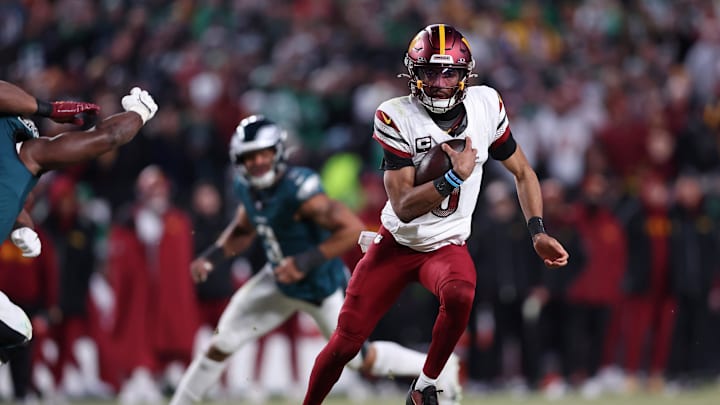 Jan 26, 2025; Philadelphia, PA, USA; Washington Commanders quarterback Jayden Daniels (5) runs with the ball against the Philadelphia Eagles during the second half in the NFC Championship game at Lincoln Financial Field. Mandatory Credit: Bill Streicher-Imagn Images